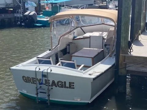 Slide: The Image of 1968 Dyer 29 Bass Boat docked in harbor. - 3