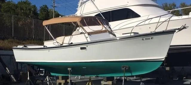 Slide: The Image of 1968 Dyer 29 Bass Boat on a dry dock. - 4