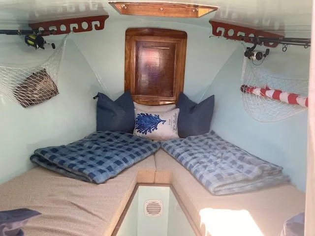 Slide: The Image of Interior of a 1968 Dyer 29 Bass Boat with cozy beds. - 7