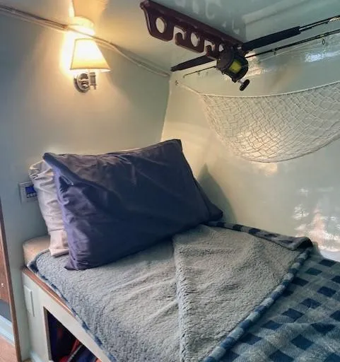 Slide: The Image of Cozy cabin interior of a 1968 Dyer 29 Bass Boat. - 9