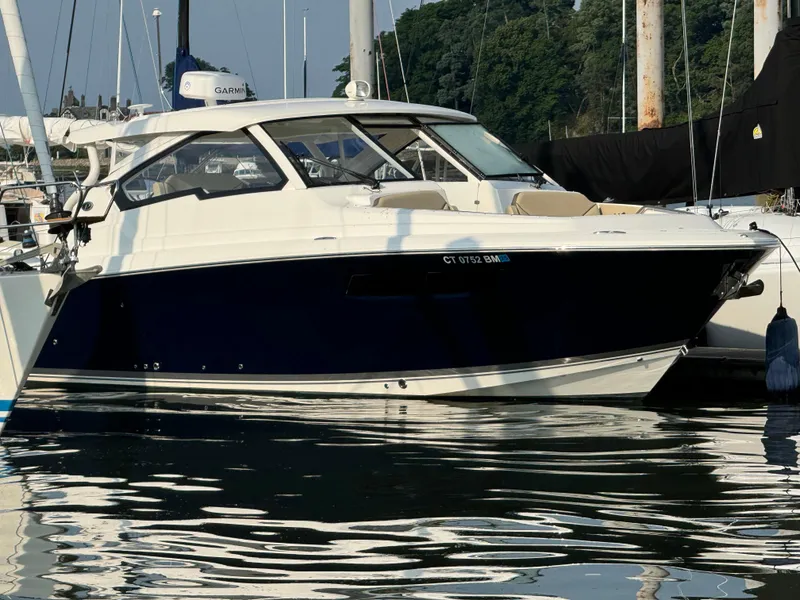 The Image of 2021 Pursuit DC 365 boat docked in marina. - 0