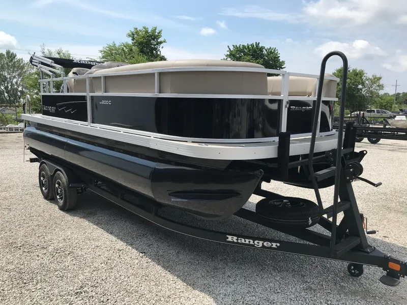 Slide: The Image of 2024 Ranger Reata 200C pontoon boat on a trailer. - 3
