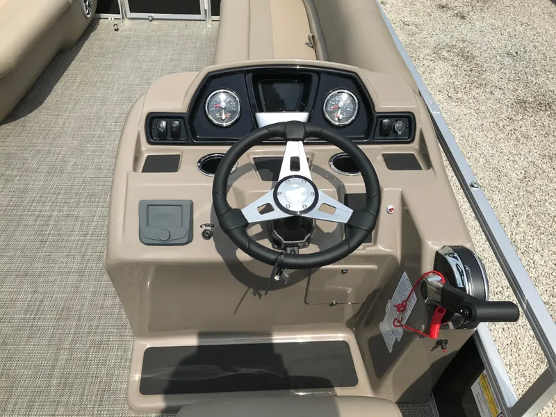 Slide: The Image of 2024 Ranger Reata 200C boat dashboard with steering wheel and gauges. - 8