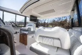 Slide: The Image of Luxurious interior of 2023 Regal Grande Coupe yacht with plush seating and modern design. - 13