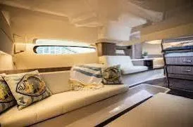 Slide: The Image of Luxurious interior of 2023 Regal Grande Coupe yacht with elegant seating and decor. - 9