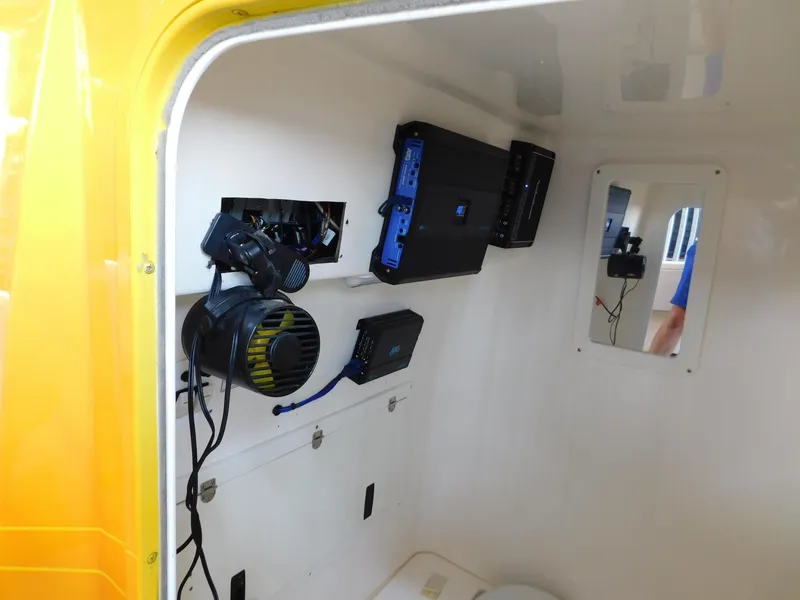 Slide: The Image of Interior electronics of 2004 Fountain 38 Sportfish CC boat, featuring mounted devices and wiring. - 18