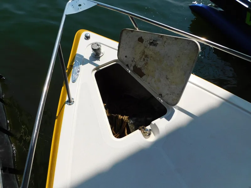 Slide: The Image of 2004 Fountain 38 Sportfish CC boat with open storage compartment on deck. - 23