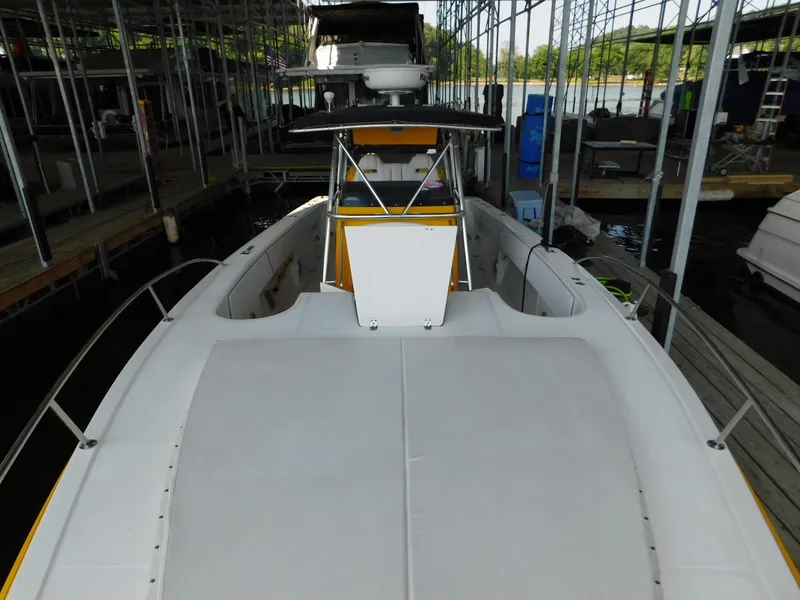 Slide: The Image of 2004 Fountain 38 Sportfish CC boat docked in marina, view from bow. - 24