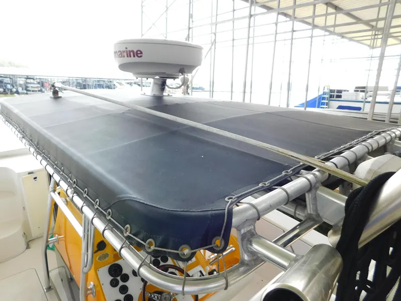 Slide: The Image of 2004 Fountain 38 Sportfish CC boat with radar and canopy. - 34