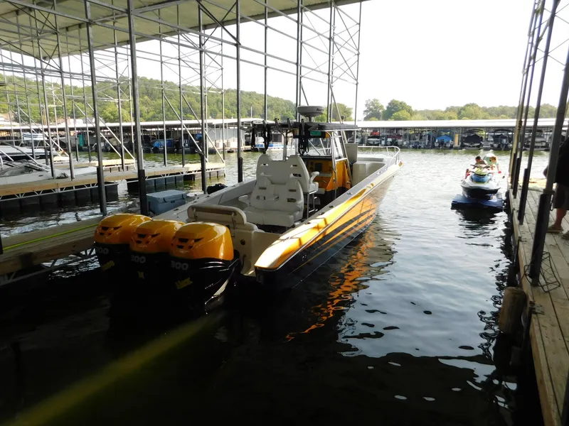 Slide: The Image of 2004 Fountain 38 Sportfish CC boat docked with dual outboard engines. - 39