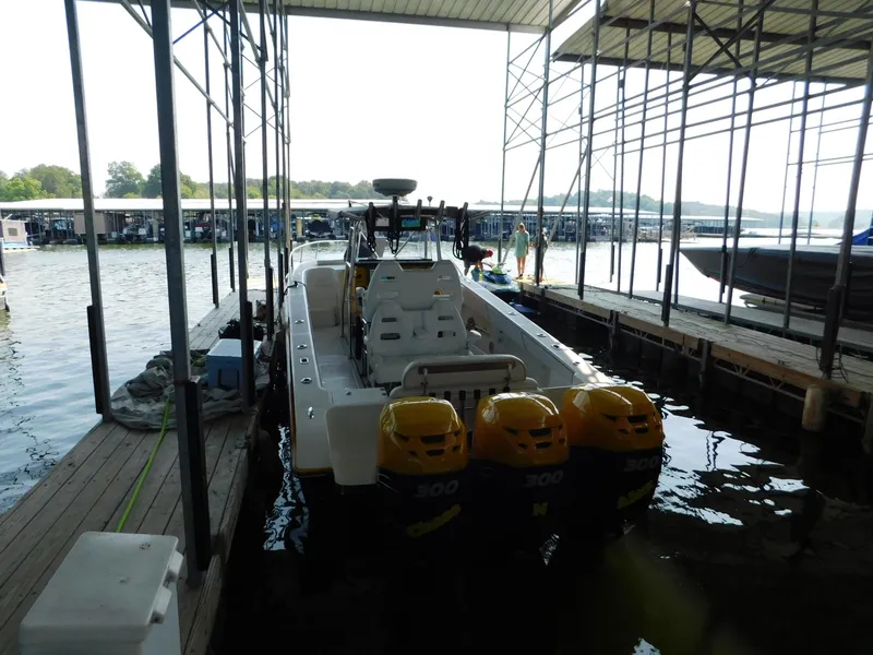 Slide: The Image of 2004 Fountain 38 Sportfish CC docked with triple outboard engines. - 44