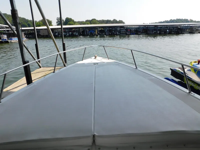 Slide: The Image of 2004 Fountain 38 Sportfish CC boat docked at a marina, view from the bow. - 49