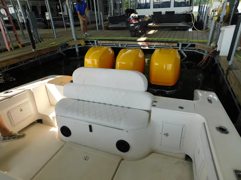 Slide: The Image of 2004 Fountain 38 Sportfish CC boat with triple outboard engines at dock. - 5