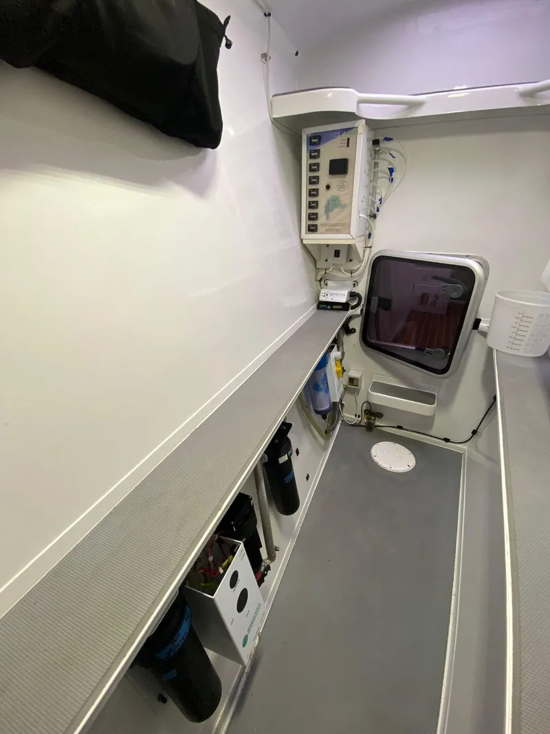 Slide: The Image of Interior of 2018 Chris White Atlantic 70 "SAPHIRA" yacht, featuring modern equipment and storage. - 19