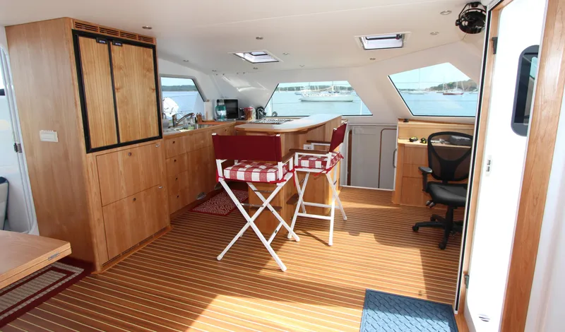 Slide: The Image of Luxurious interior of 2018 Chris White Atlantic 70 "SAPHIRA" yacht with wooden flooring and seating. - 8
