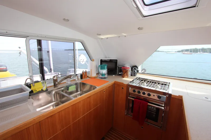 Slide: The Image of Modern kitchen interior on Chris White Atlantic 70 "SAPHIRA" yacht, featuring ocean view. - 9