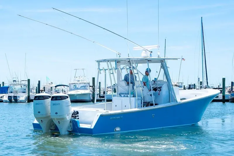 Slide: The Image of Custom 31 2020 boat with twin outboard engines in a marina. - 17