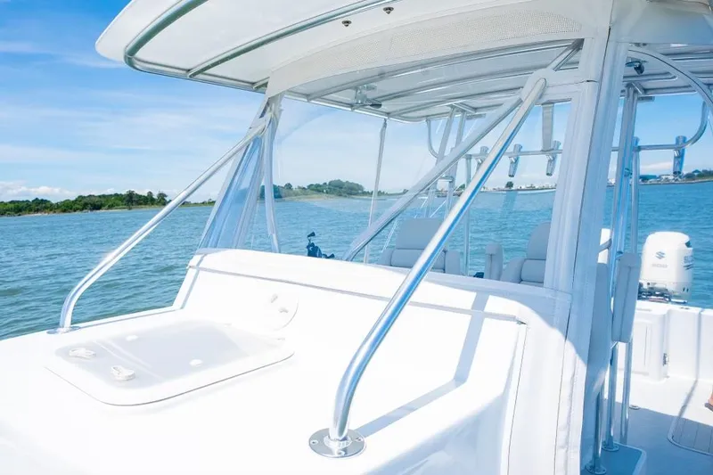 Slide: The Image of Custom 31 boat, 2020 model, on a sunny day at sea. - 26