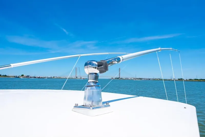 Slide: The Image of Custom 31 boat, 2020 model, with a clear view of the bow and water. - 28