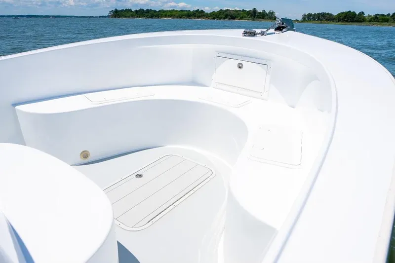 Slide: The Image of Custom 31 boat 2020 model, white interior, spacious seating, and storage compartments. - 30