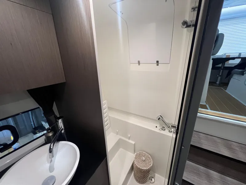 Slide: The Image of 2023 Beneteau Gran Turismo 32 bathroom with modern sink and shower. - 14