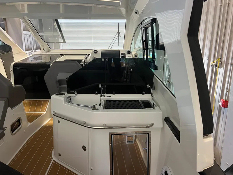 Slide: The Image of Interior of 2023 Beneteau Gran Turismo 32 yacht with modern cockpit and seating area. - 3