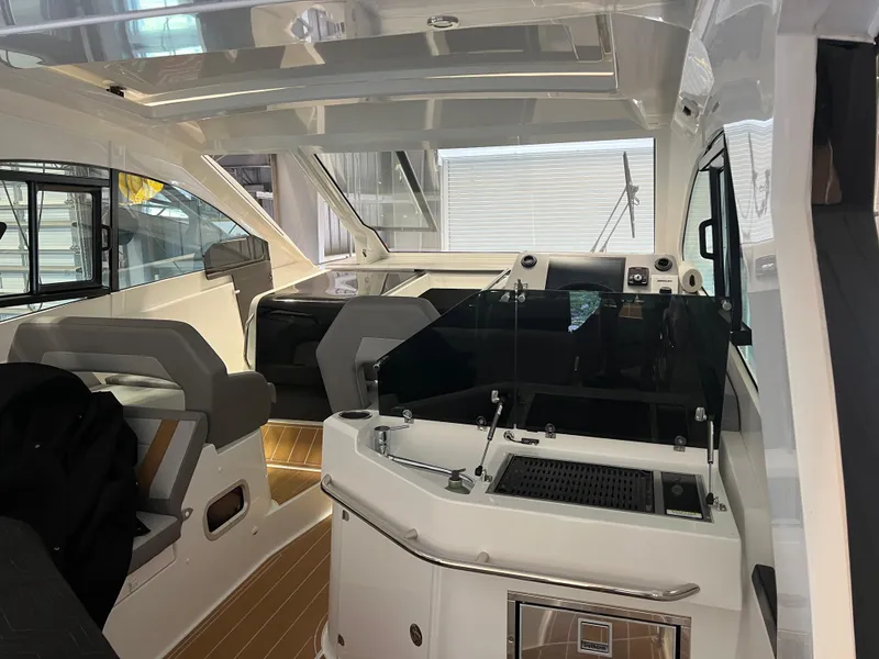 Slide: The Image of Interior of 2023 Beneteau Gran Turismo 32 yacht with modern seating and helm station. - 4
