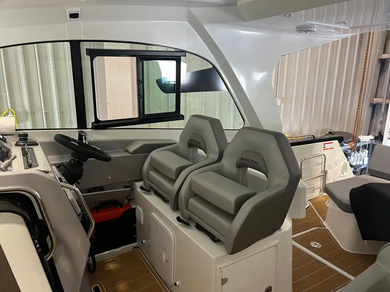 Slide: The Image of Interior of 2023 Beneteau Gran Turismo 32 with dual helm seats and modern dashboard. - 7