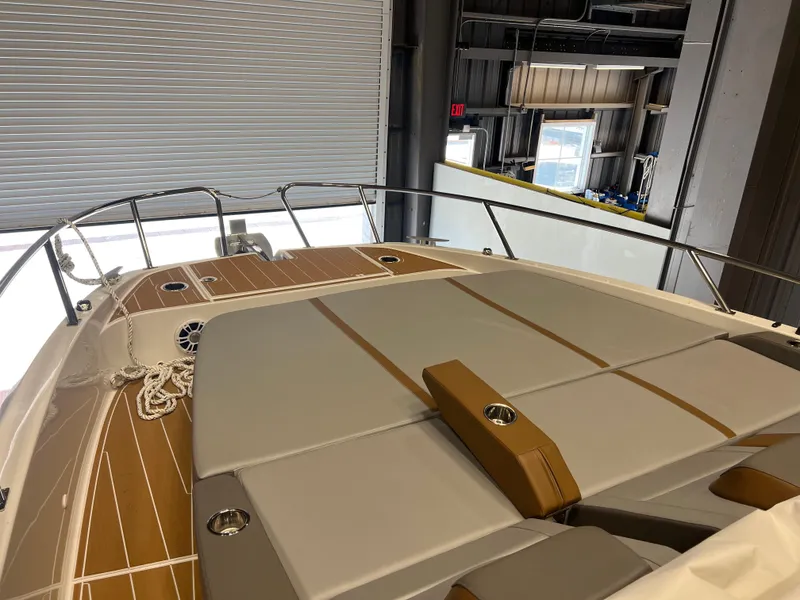 Slide: The Image of 2023 Beneteau Gran Turismo 32 yacht interior with cushioned deck and wooden flooring. - 9