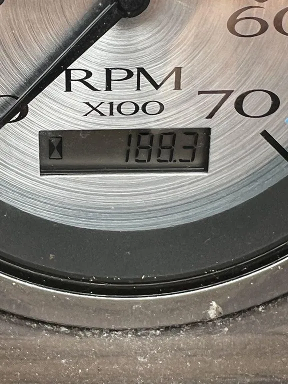 Slide: The Image of Close-up of 2019 Bennington 25 SPDXP RPM gauge showing 168.3 hours. - 19