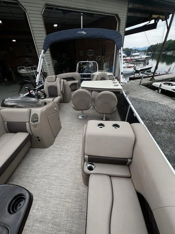Slide: The Image of 2019 Bennington 25 SPDXP pontoon boat with spacious seating and modern amenities. - 3