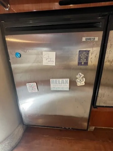 Slide: The Image of Stainless steel fridge with stickers in a 2002 Sea Ray 360 Sundancer yacht. - 30