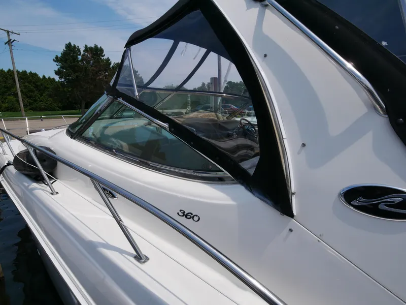 Slide: The Image of 2002 Sea Ray 360 Sundancer boat docked, side view. - 5