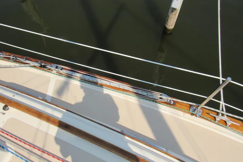 Slide: The Image of 1987 Island Packet 31 sailboat deck with rigging and shadow. - 19