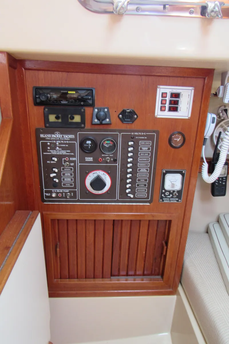 Slide: The Image of Electrical panel of a 1987 Island Packet 31 sailboat with various controls and gauges. - 8