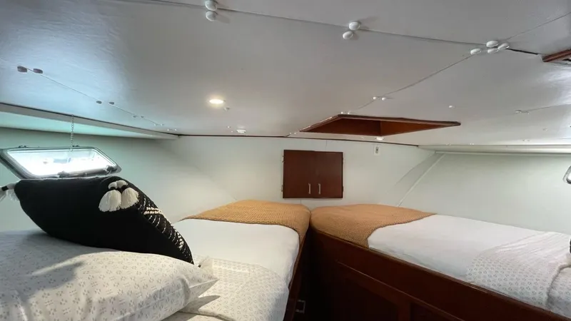 Slide: The Image of 1976 Nordlund 60 Motoryacht cabin with twin beds and nautical decor. - 22