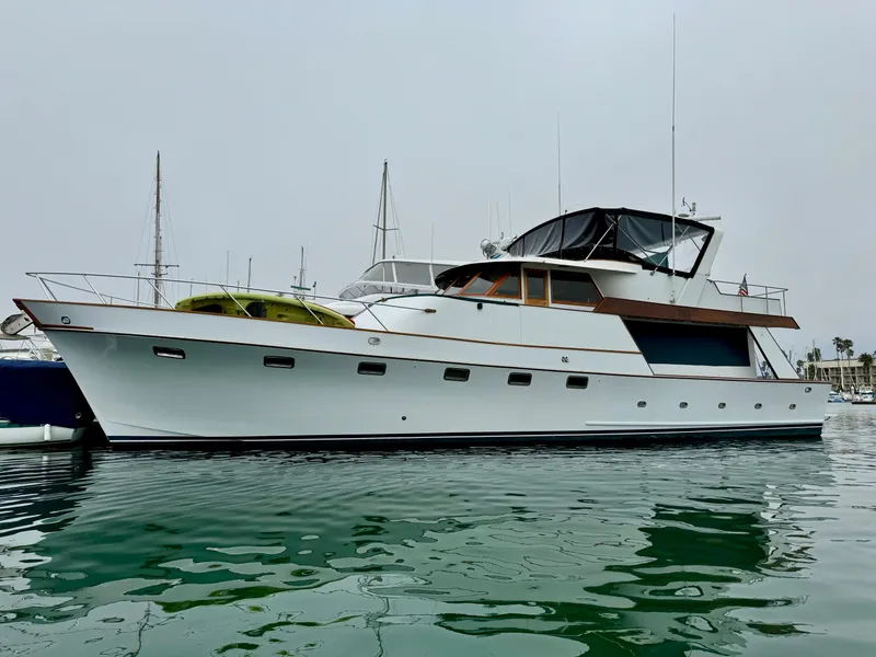 Slide: The Image of 1976 Nordlund 60 Motoryacht on calm water, showcasing classic design and elegance. - 73