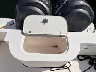 Slide: The Image of Open storage compartment on a 2005 Contender 35 Side Console boat with twin Yamaha engines. - 10