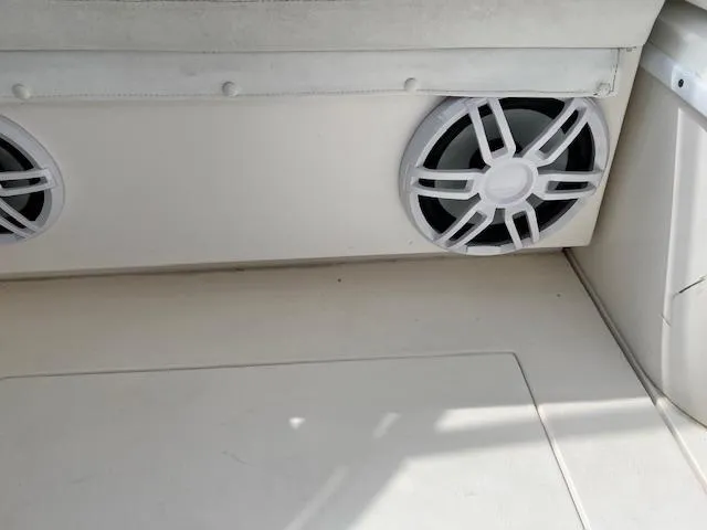 Slide: The Image of 2005 Contender 35 Side Console boat interior with dual speakers. - 18