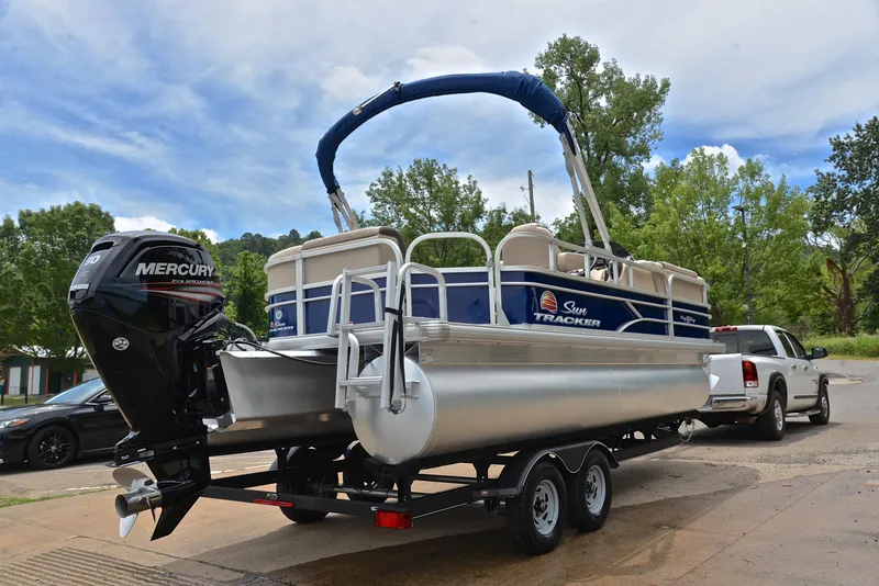 Slide: The Image of 2018 Sun Tracker Party Barge 20 DLX pontoon boat on trailer with Mercury outboard motor. - 14
