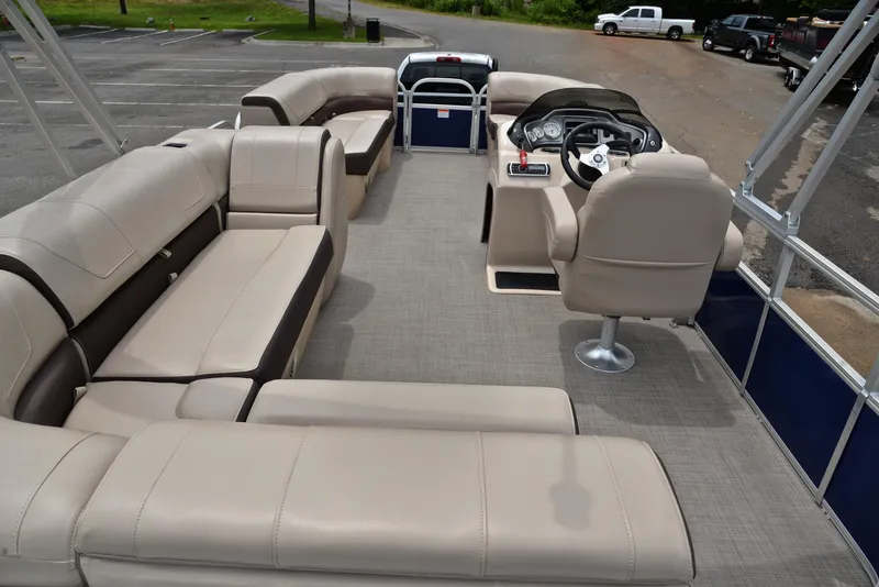Slide: The Image of 2018 Sun Tracker Party Barge 20 DLX pontoon boat with spacious seating and modern helm. - 18