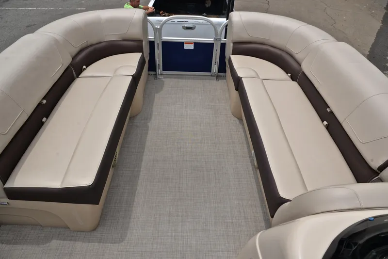 Slide: The Image of 2018 Sun Tracker Party Barge 20 DLX interior with beige and brown seating. - 21
