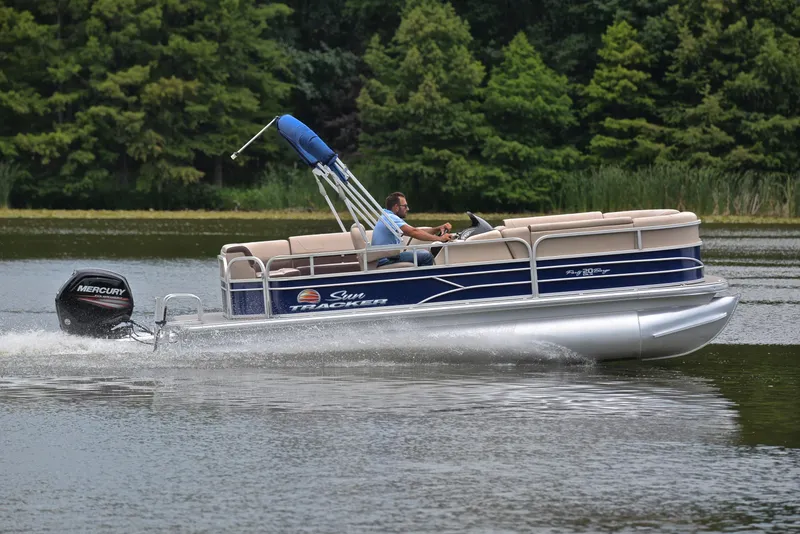 Slide: The Image of 2018 Sun Tracker Party Barge 20 DLX pontoon boat cruising on a lake. - 3