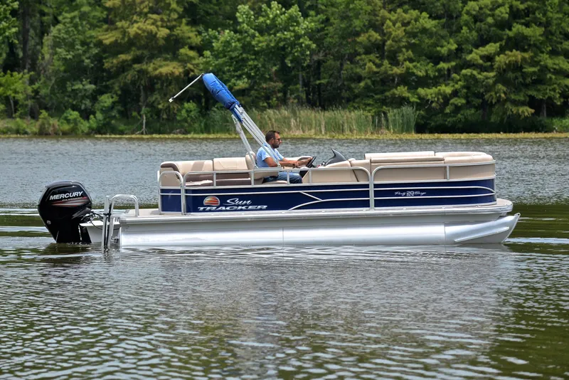 Slide: The Image of 2018 Sun Tracker Party Barge 20 DLX pontoon boat on a lake. - 6