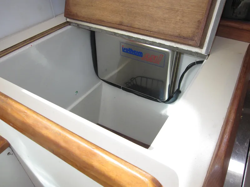 Slide: The Image of Interior of 1990 Blue Seas 31 Hardtop Cruiser showing storage compartment. - 12