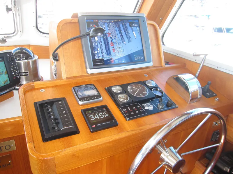 Slide: The Image of Control panel of a 1990 Blue Seas 31 Hardtop Cruiser with navigation equipment. - 15