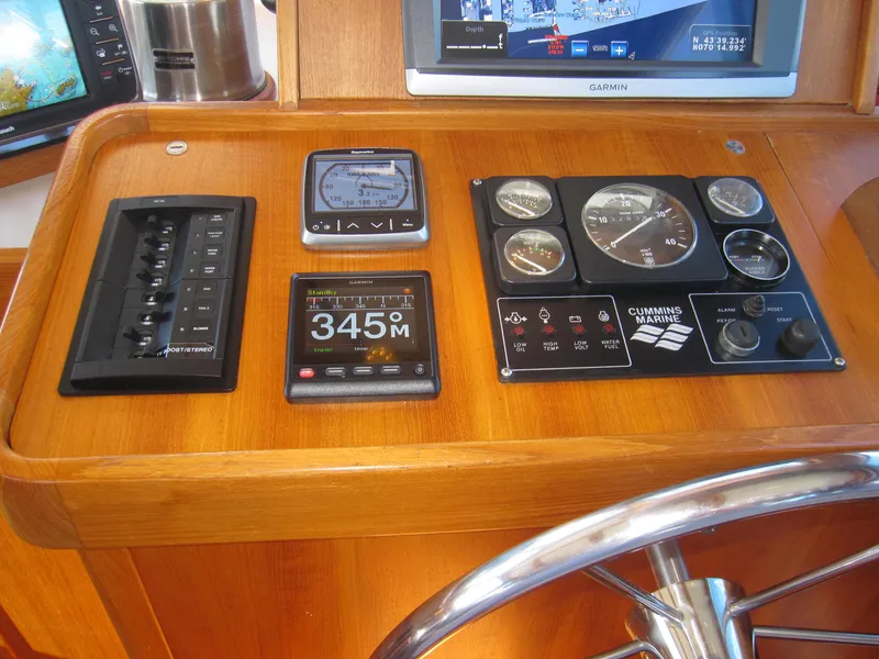 Slide: The Image of Control panel of a 1990 Blue Seas 31 Hardtop Cruiser with navigation instruments. - 18