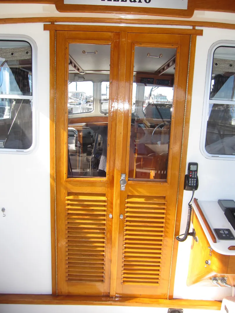 Slide: The Image of 1990 Blue Seas 31 Hardtop Cruiser wooden cabin doors. - 34