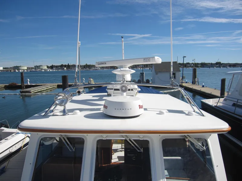 Slide: The Image of 1990 Blue Seas 31 Hardtop Cruiser docked at a marina. - 37