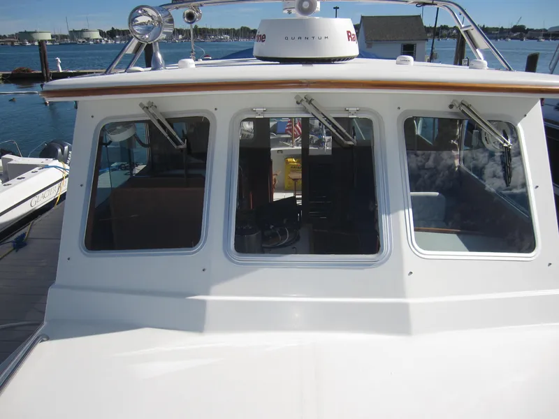 Slide: The Image of 1990 Blue Seas 31 Hardtop Cruiser boat docked at marina. - 39